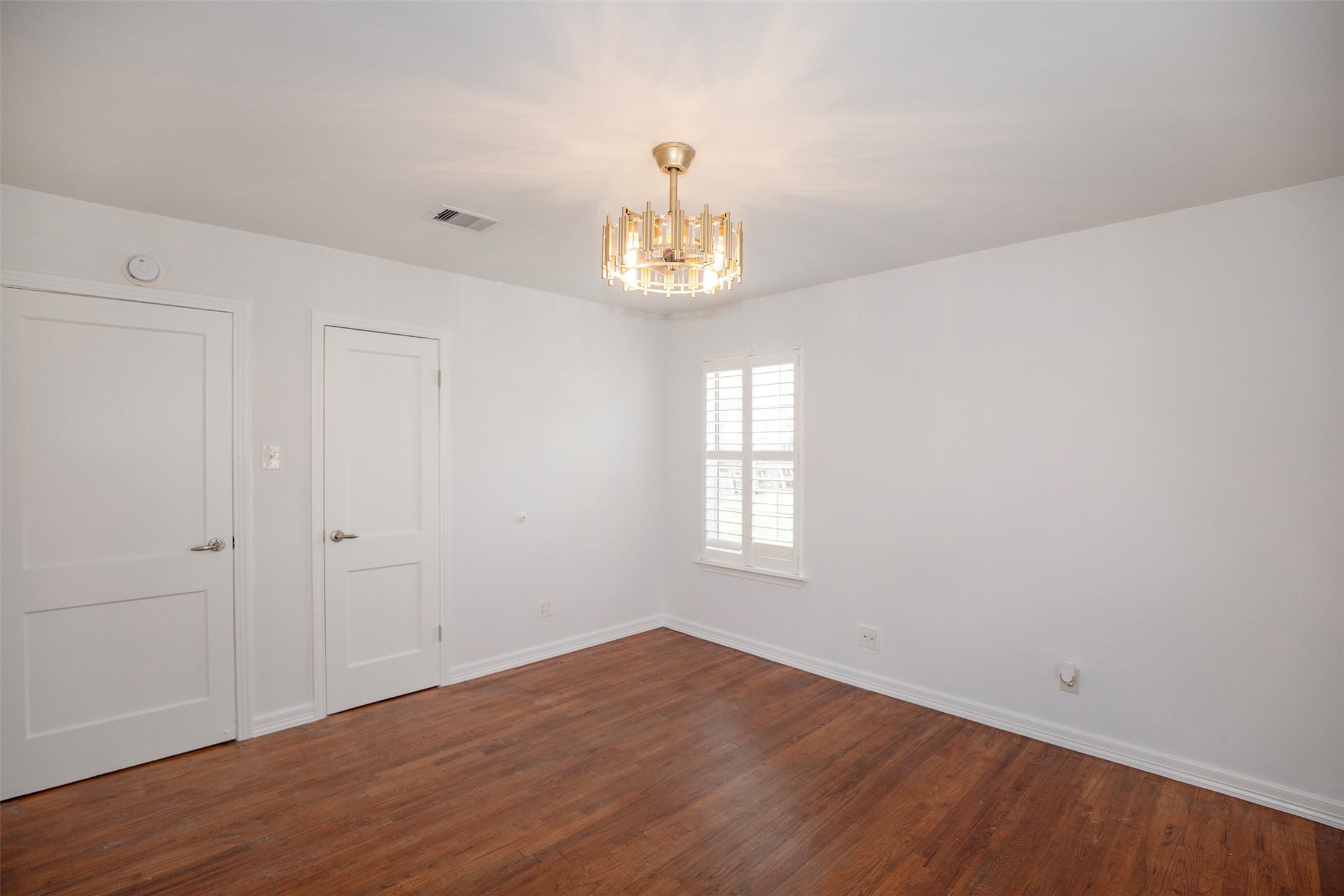 5535 Allendale Road Houston, TX 77017 - Photo 22 of 29 wooden floor in an empty room with a window