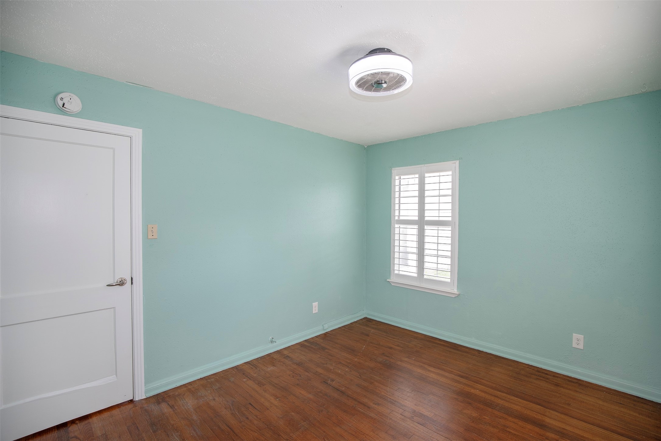 5535 Allendale Road Houston, TX 77017 - Photo 24 of 29 a view of an empty room with wooden floor and a window