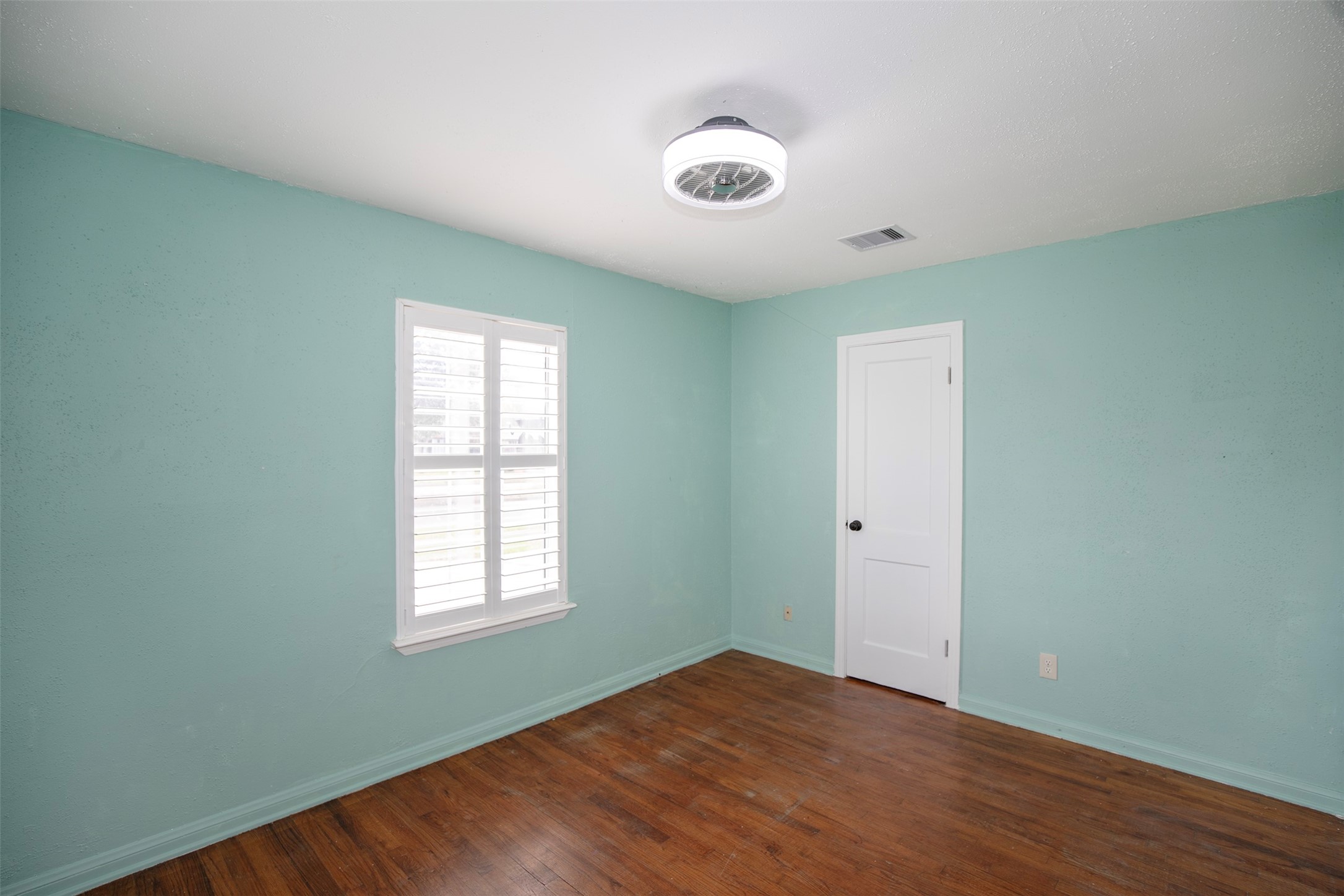 5535 Allendale Road Houston, TX 77017 - Photo 25 of 29 a view of an empty room with wooden floor and a window