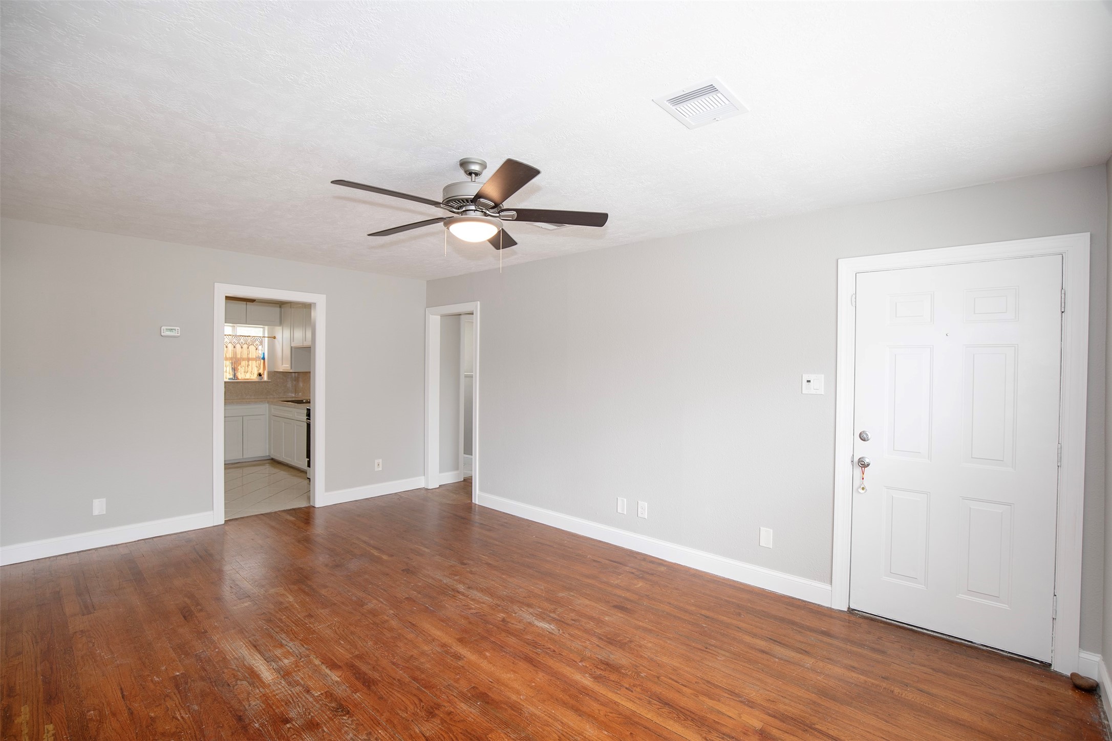 5535 Allendale Road Houston, TX 77017 - Photo 6 of 29 an empty room with wooden floor and windows