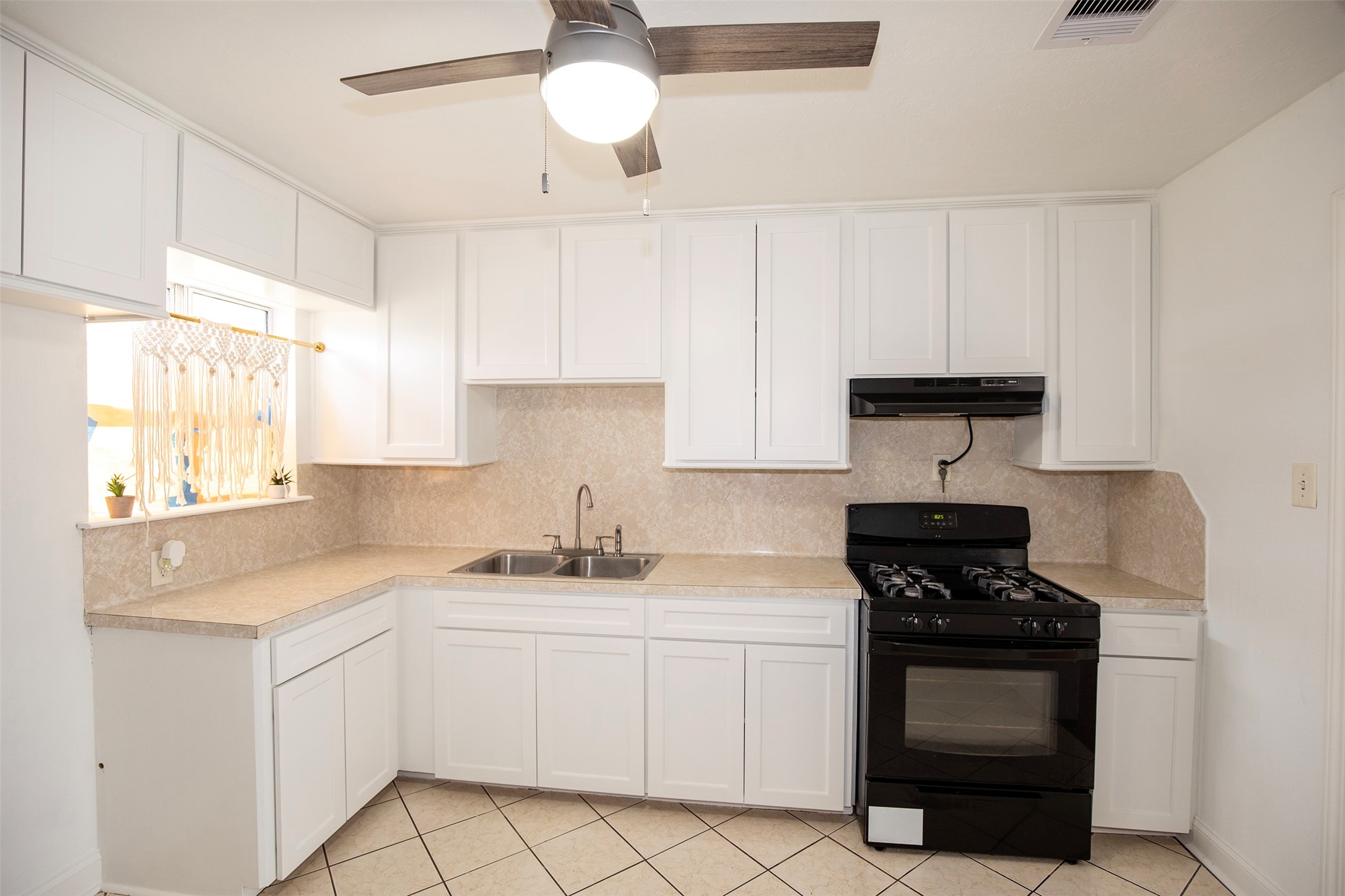 5535 Allendale Road Houston, TX 77017 - Photo 8 of 29 a kitchen with white cabinets and appliances