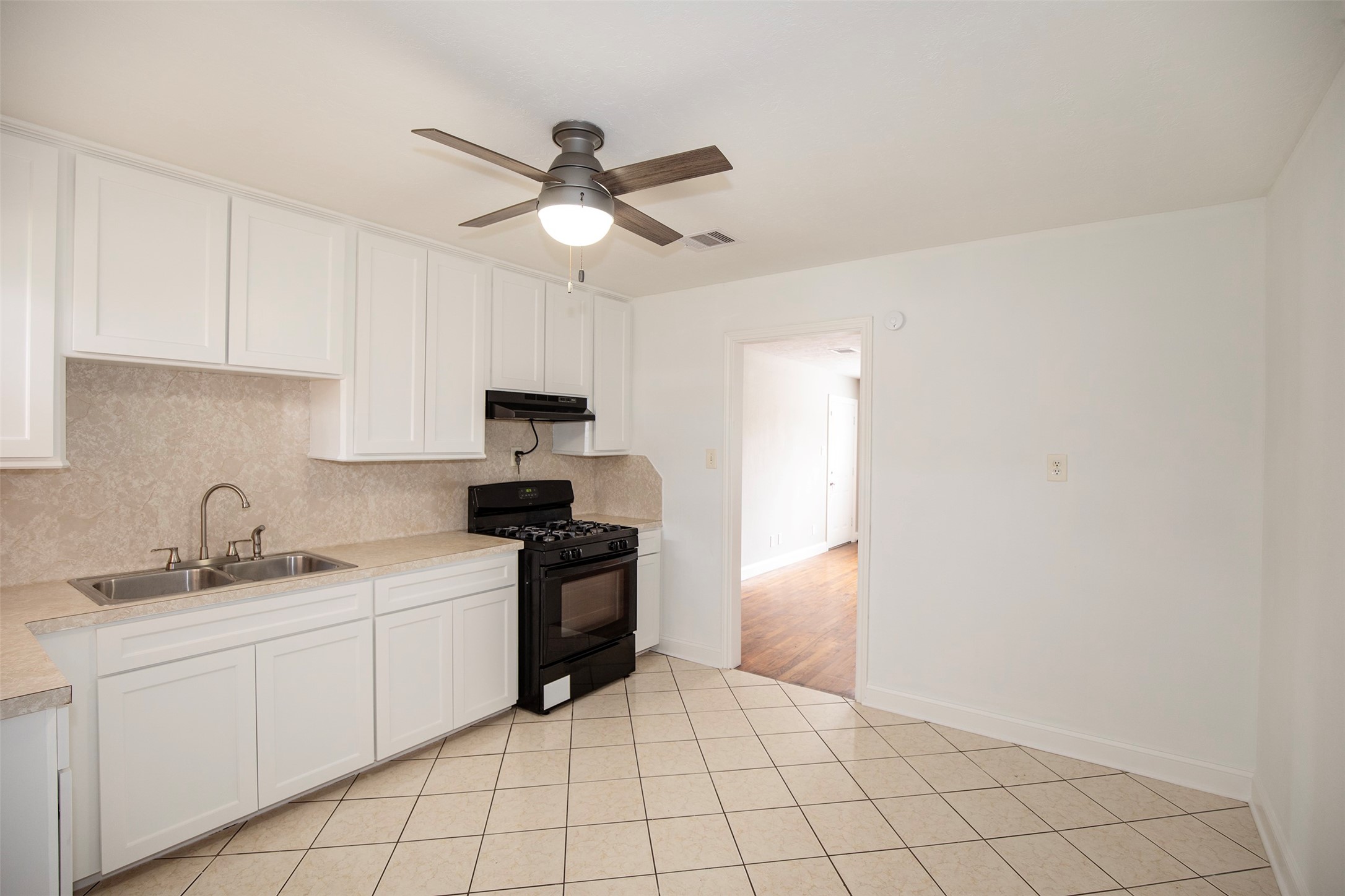 5535 Allendale Road Houston, TX 77017 - Photo 10 of 29 a kitchen with a sink cabinets and appliances