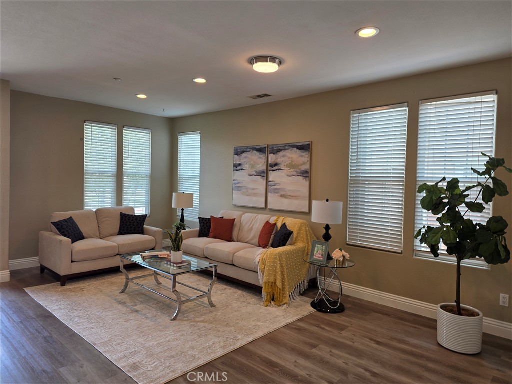20329 Red Poppy Lane Riverside, CA 92508 - Photo 6 of 24 a living room with furniture flowers and a window