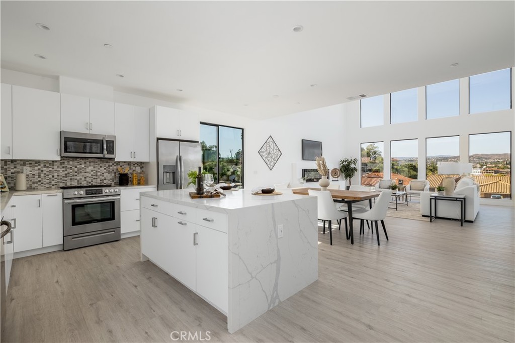 28896 Vacation Drive Canyon Lake, CA 92587 - Photo 12 of 39 a kitchen with white cabinets and appliances