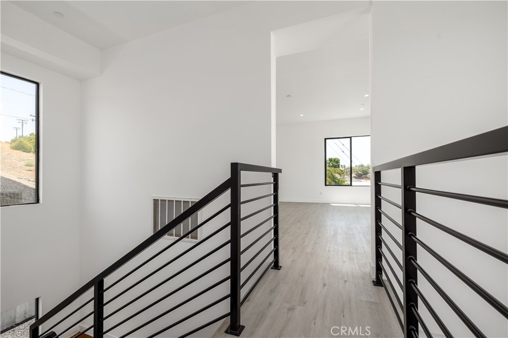 28896 Vacation Drive Canyon Lake, CA 92587 - Photo 16 of 39 a view of entryway and hall with wooden floor