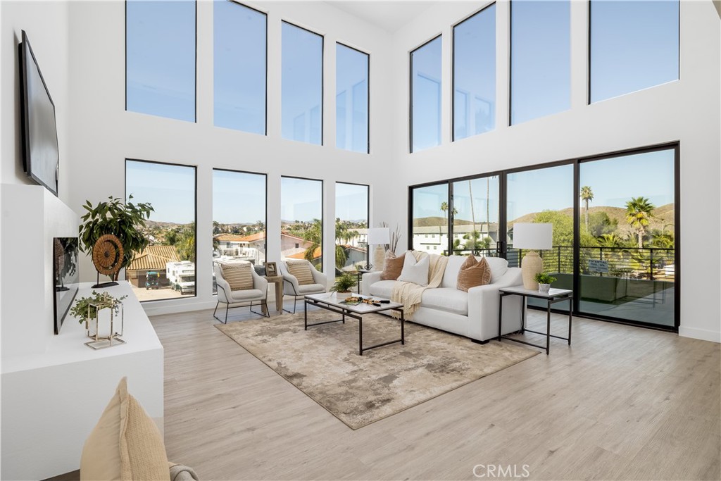 28896 Vacation Drive Canyon Lake, CA 92587 - Photo 2 of 39 a living room with furniture large windows and flat screen tv