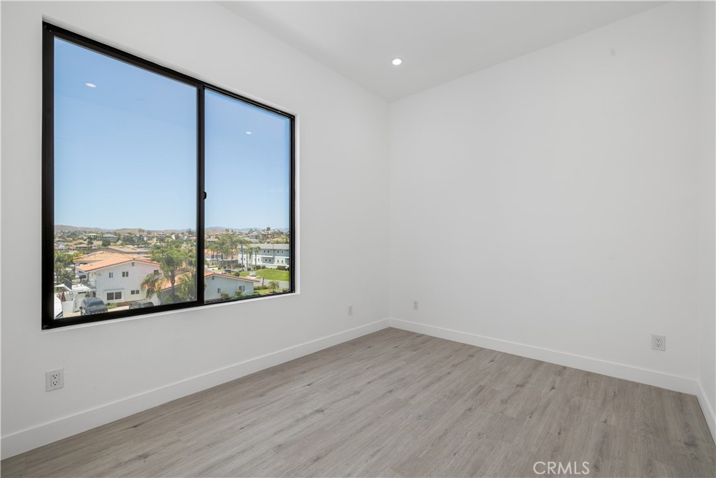 28896 Vacation Drive Canyon Lake, CA 92587 - Photo 21 of 39 a view of a small space with wooden floor and a window