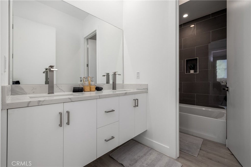 28896 Vacation Drive Canyon Lake, CA 92587 - Photo 22 of 39 a bathroom with double sink and a mirror