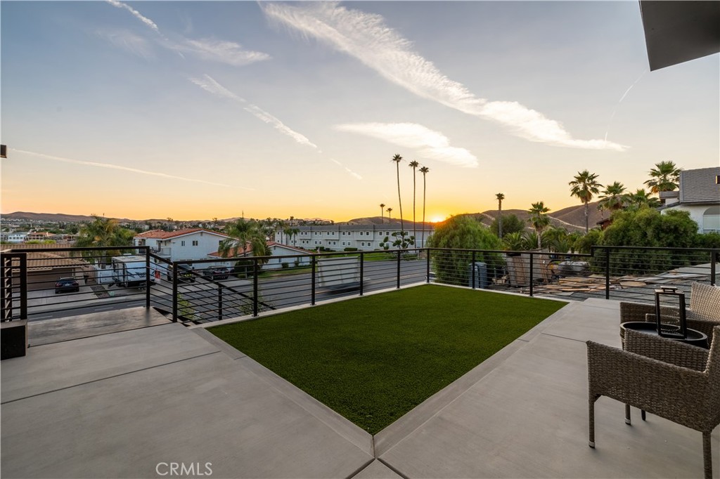 28896 Vacation Drive Canyon Lake, CA 92587 - Photo 27 of 39 a view of a terrace with a garden and chairs