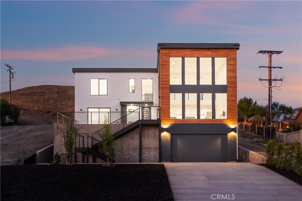 28896 Vacation Drive Canyon Lake, CA 92587 - Photo 32 of 39 a view of a livingroom with furniture staircase and a kitchen