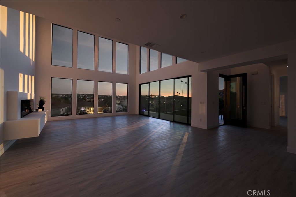 28896 Vacation Drive Canyon Lake, CA 92587 - Photo 36 of 39 a view of an empty room with wooden floor and a window