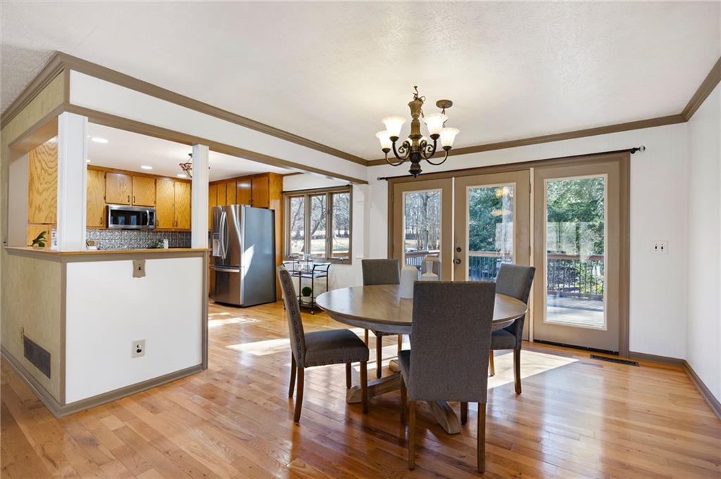 8277 Buchanan Highway Dallas, GA 30157 - Photo 23 of 36 a view of a dining room with furniture window and wooden floor