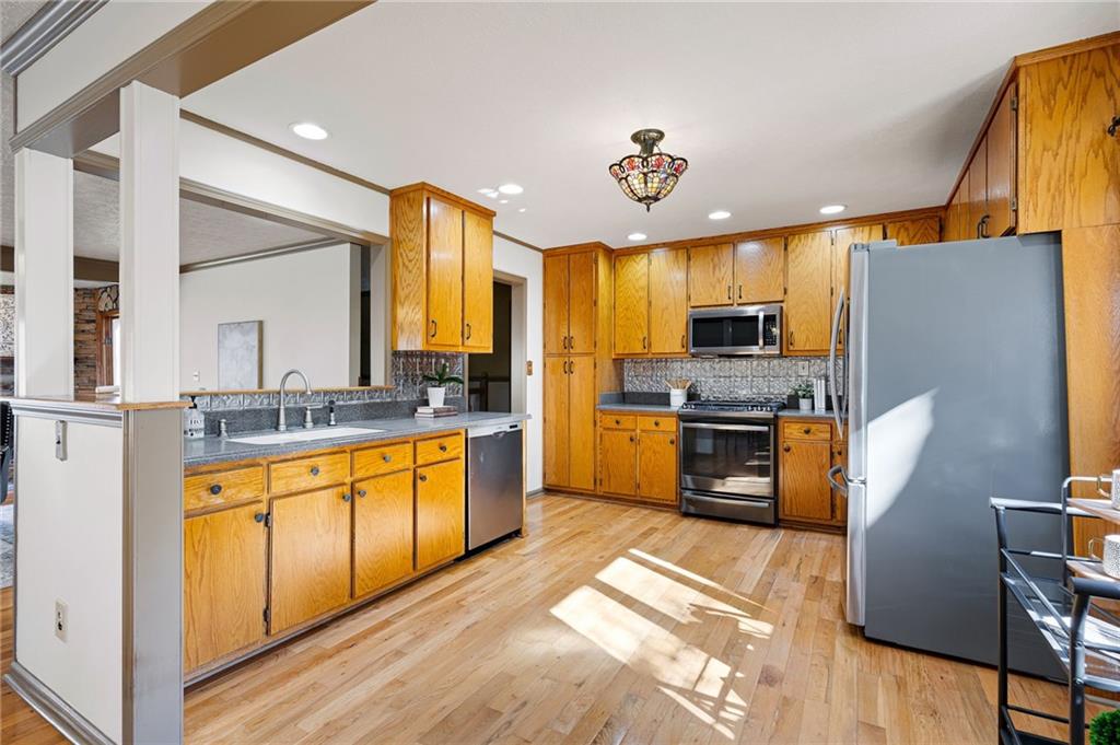 8277 Buchanan Highway Dallas, GA 30157 - Photo 25 of 36 a kitchen with stainless steel appliances granite countertop a refrigerator a stove and a sink