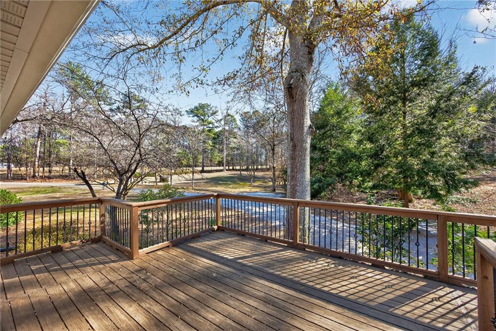 8277 Buchanan Highway Dallas, GA 30157 - Photo 29 of 36 a view of a balcony with wooden floor and fence