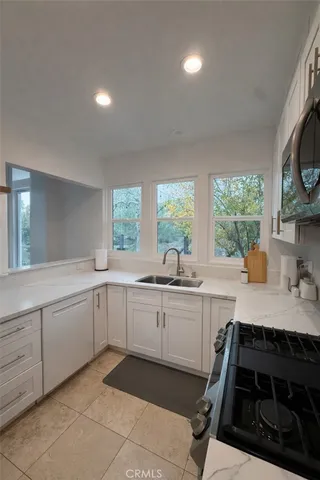 a kitchen with sink and window
