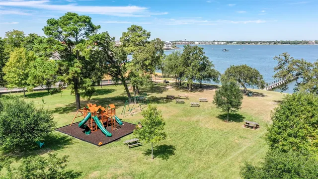 a view of a lake with a yard