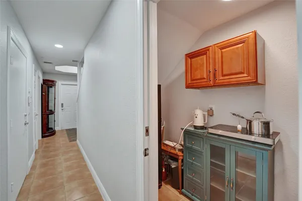a hallway with washer and dryer