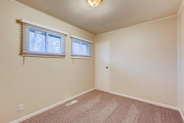 1923 Cherokee Road Carpentersville, IL 60110 - Photo 12 of 17 a view of an empty room with a window