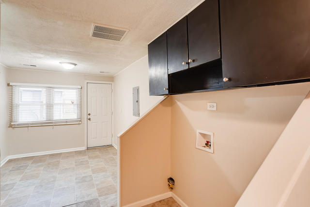1923 Cherokee Road Carpentersville, IL 60110 - Photo 15 of 17 a view of a kitchen with wooden floor