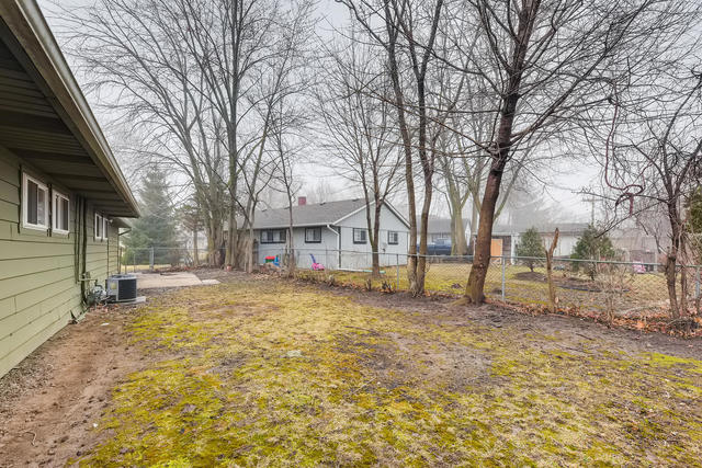 1923 Cherokee Road Carpentersville, IL 60110 - Photo 16 of 17 a view of a yard with a house in the background