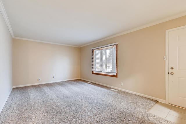 1923 Cherokee Road Carpentersville, IL 60110 - Photo 3 of 17 an empty room with windows