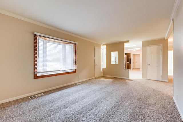 1923 Cherokee Road Carpentersville, IL 60110 - Photo 4 of 17 a view of an empty room with a window