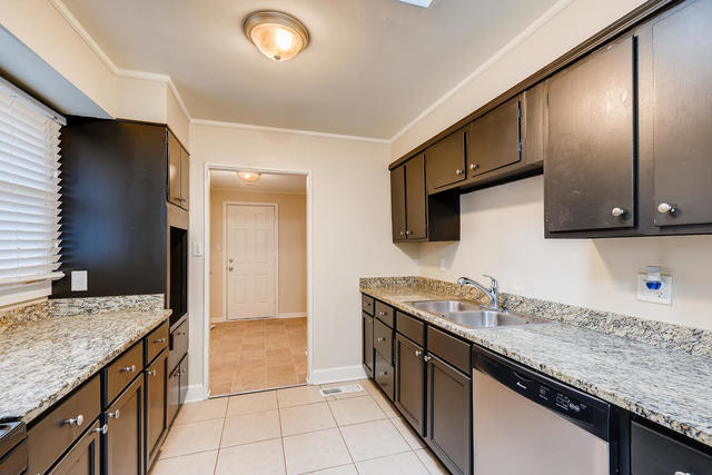 1923 Cherokee Road Carpentersville, IL 60110 - Photo 6 of 17 a kitchen with stainless steel appliances granite countertop a sink and a granite counter tops