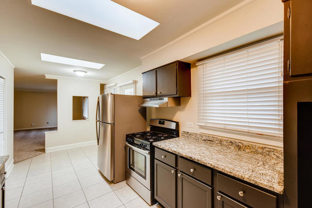 1923 Cherokee Road Carpentersville, IL 60110 - Photo 8 of 17 a kitchen with a refrigerator and a stove
