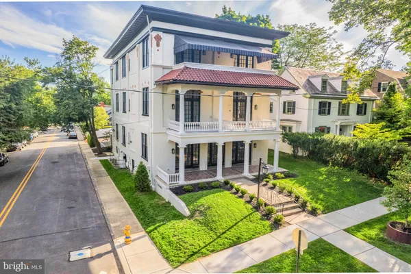 a front view of a house with a yard table and chairs