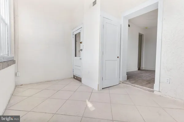 an empty room with a bathroom