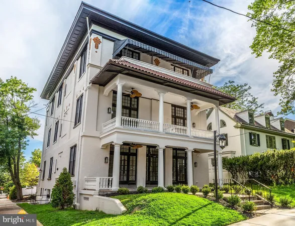 a view of white house with yard and windows