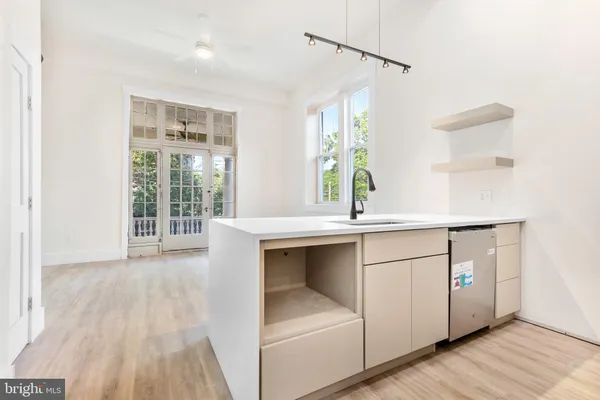 a kitchen with a sink and a window