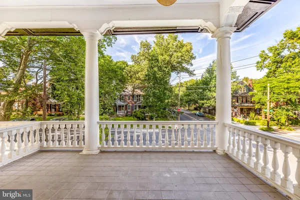 a view of a porch with wooden floor