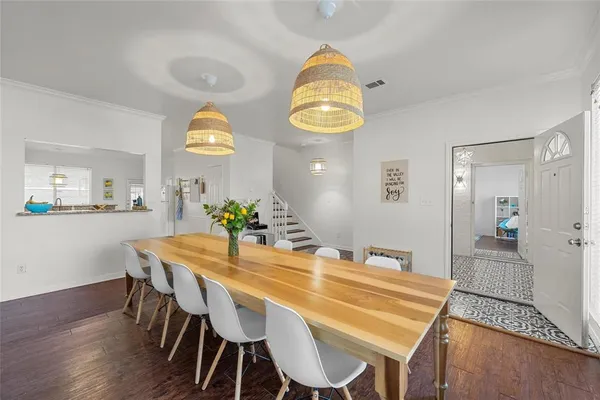 a view of a dining room and a table