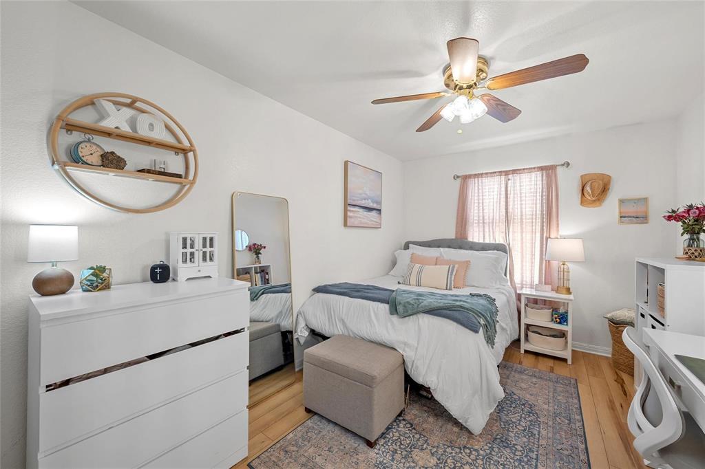1915 South 7th Street Waco, TX 76706 - Photo 14 of 40 a living room with a bed furniture and a window