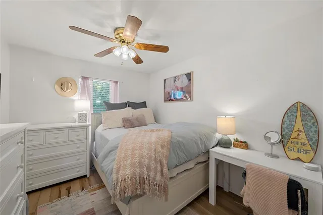 a living room with a bed furniture and a window