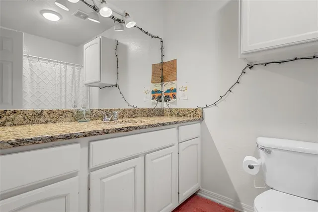 a bedroom with a bed and a desk