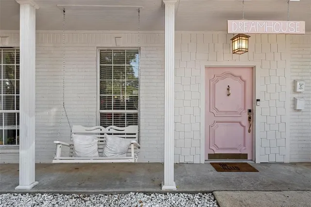 a view of a door with a hallway