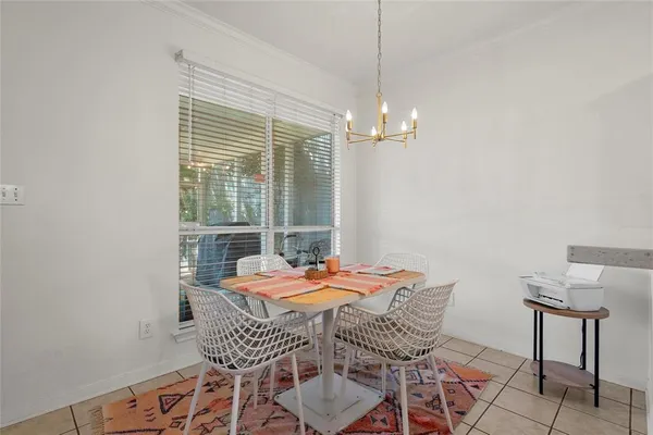 a outdoor space with a table and chairs