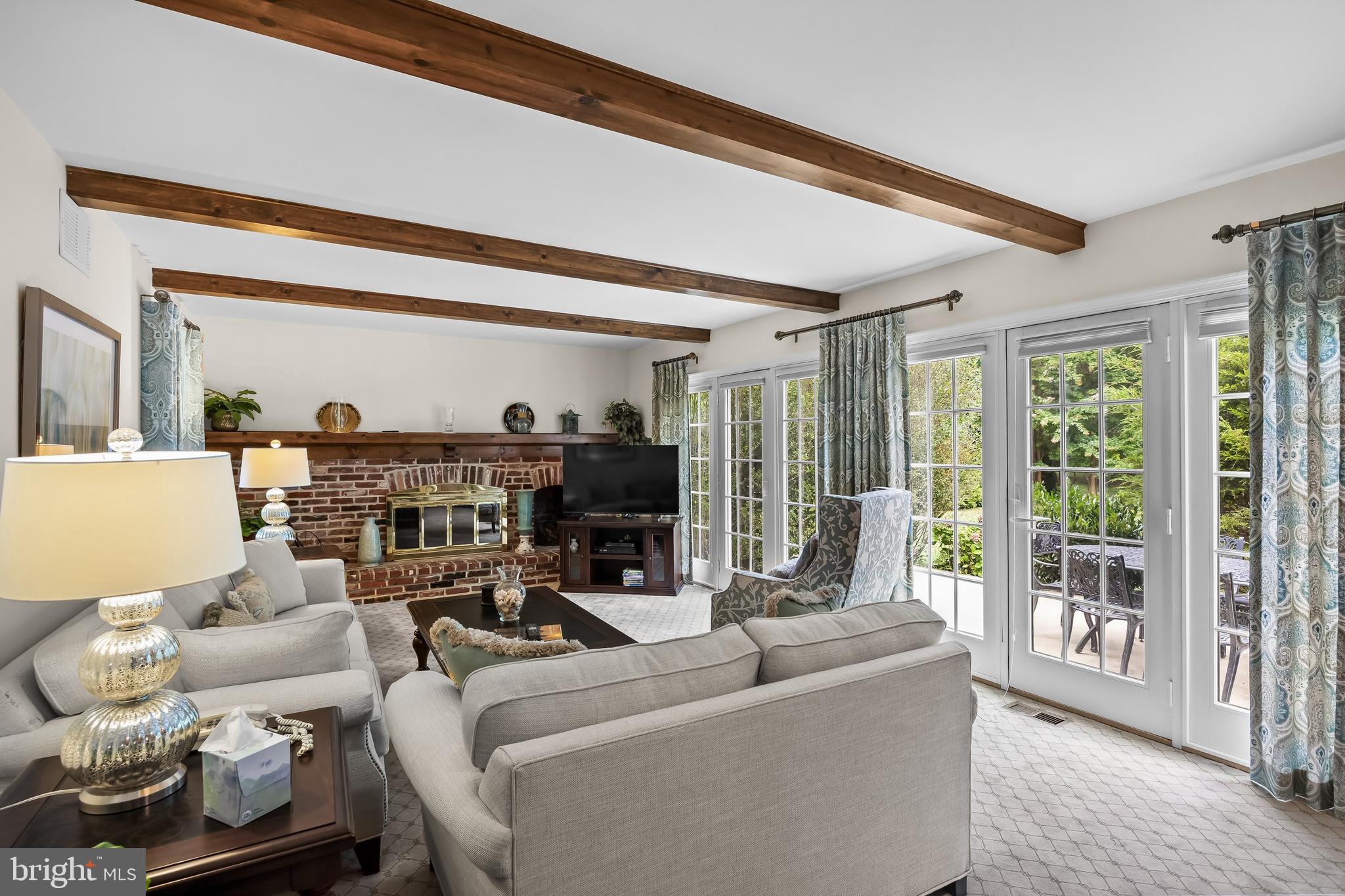 803 Fernwood Road Moorestown, NJ 08057 - Photo 11 of 46 a living room with furniture and a floor to ceiling window