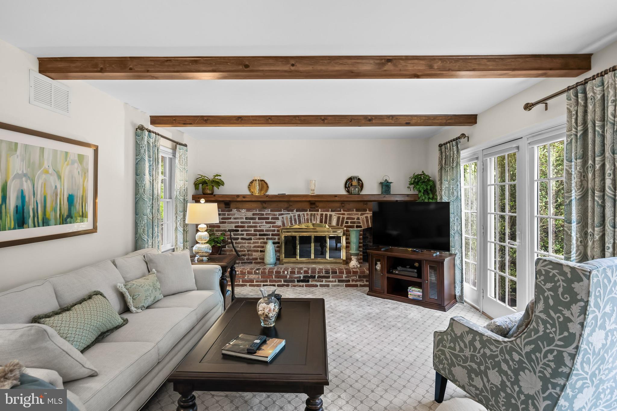 803 Fernwood Road Moorestown, NJ 08057 - Photo 12 of 46 a living room with furniture a fireplace and a flat screen tv