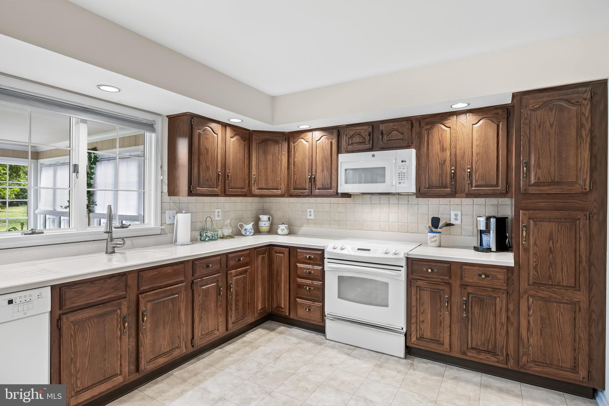 803 Fernwood Road Moorestown, NJ 08057 - Photo 18 of 46 a kitchen with sink a stove and cabinets