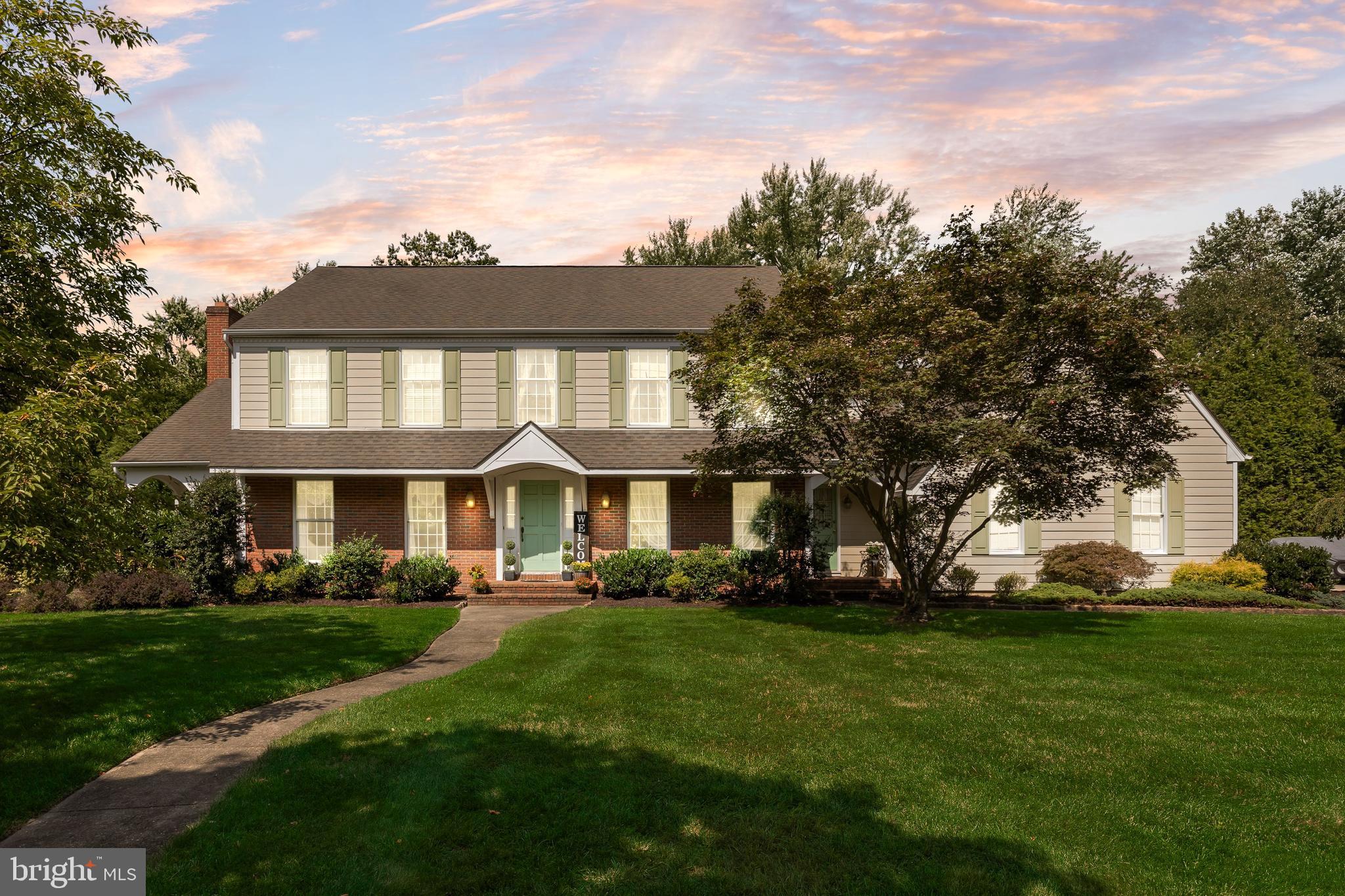 803 Fernwood Road Moorestown, NJ 08057 - Photo 46 of 46 a front view of a house with a garden and trees