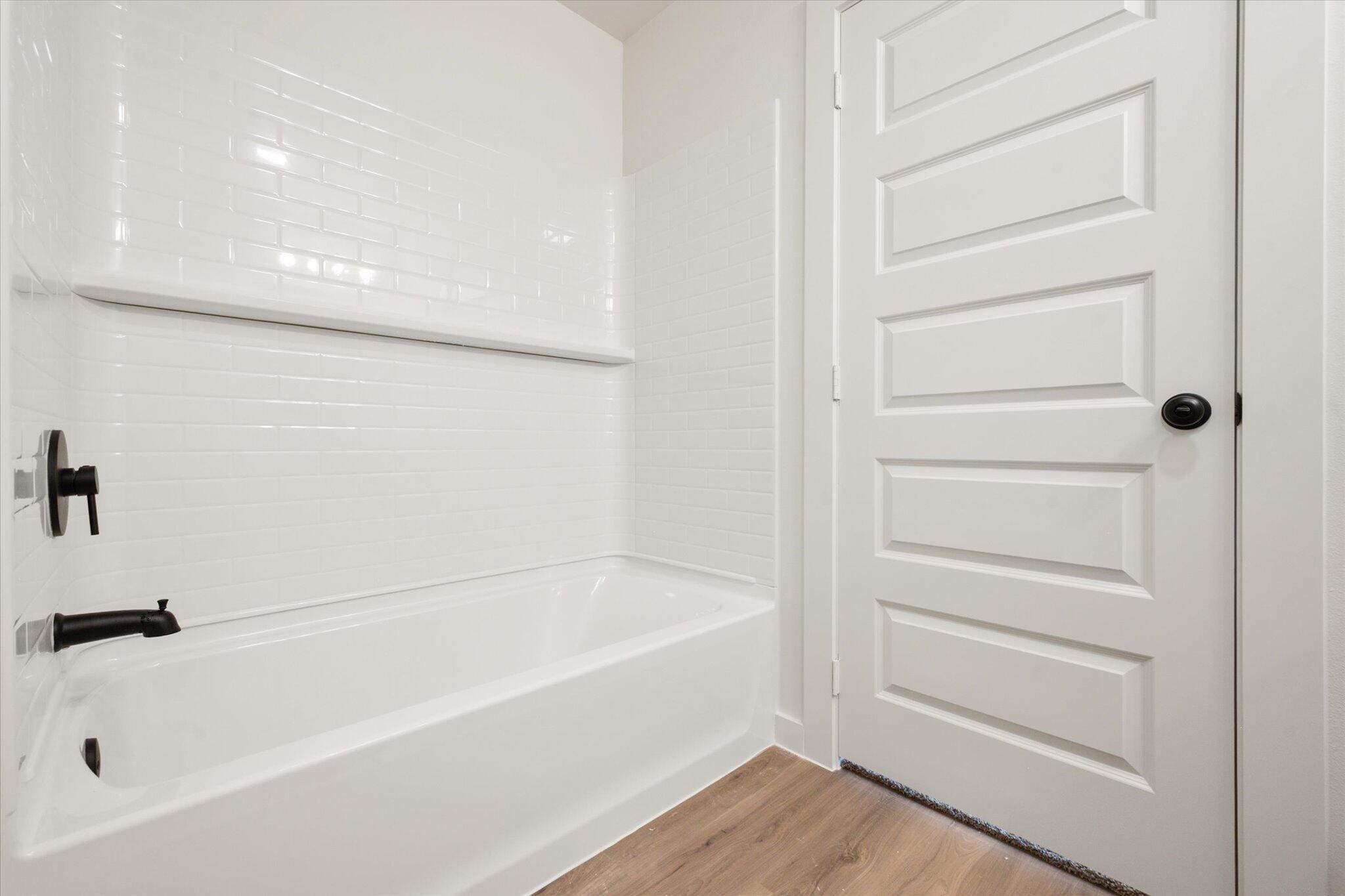 6311 Volney Avenue Lubbock, TX 79407 - Photo 16 of 23 a bathroom with a bathtub
