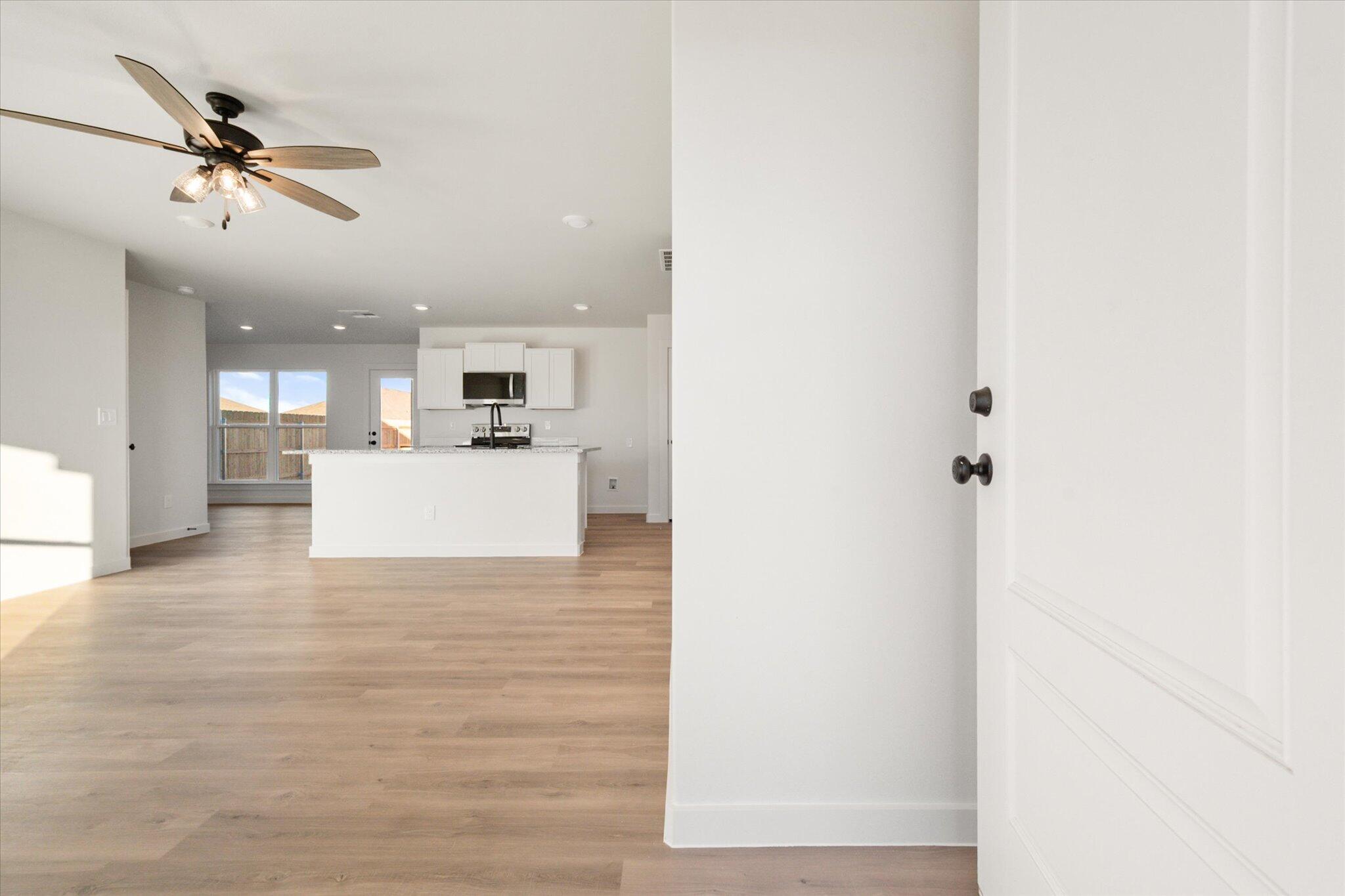 6311 Volney Avenue Lubbock, TX 79407 - Photo 2 of 23 a view of a kitchen with a sink and a refrigerator
