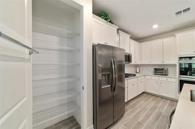 a kitchen with a refrigerator a sink and dishwasher