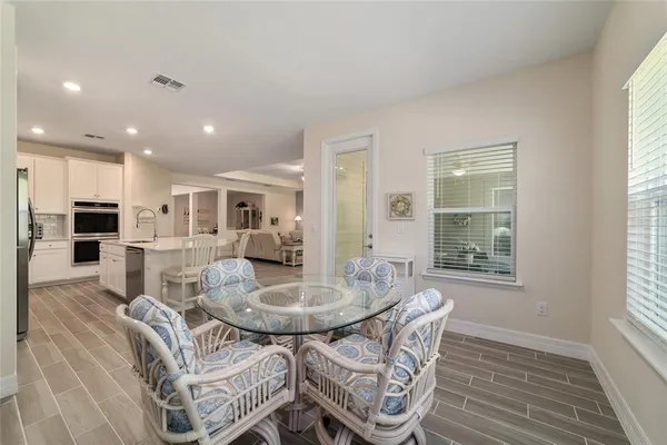 a dining room with furniture and window