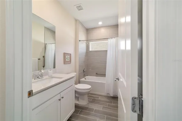 a room with a bed and a chandelier