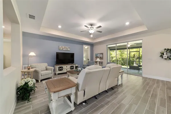 a living room with furniture fireplace and a flat screen tv