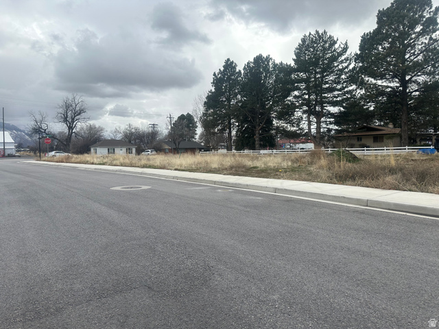 841 1400 West, Unit 1 Mapleton, UT 84664 - Photo 3 of 5 View of asphalt road with sidewalks, curbs, and traffic signs
